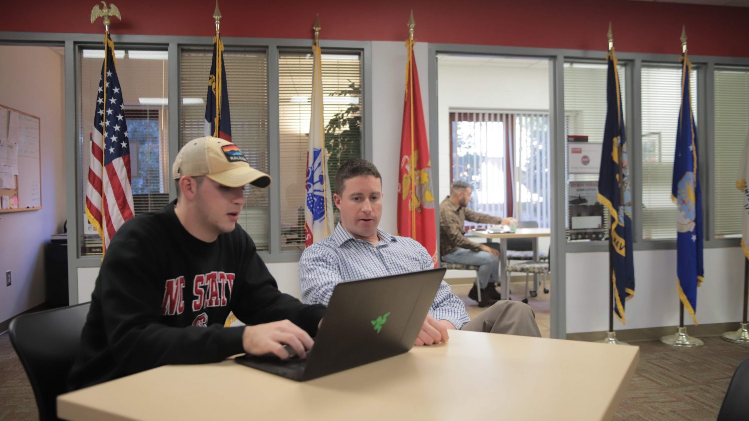 Student Will Beam and Nick Drake meet at the Military and Veteran Services suite