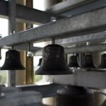 close up of small bells in belfry