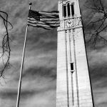 The American flag flies beside the Memorial Belltower.