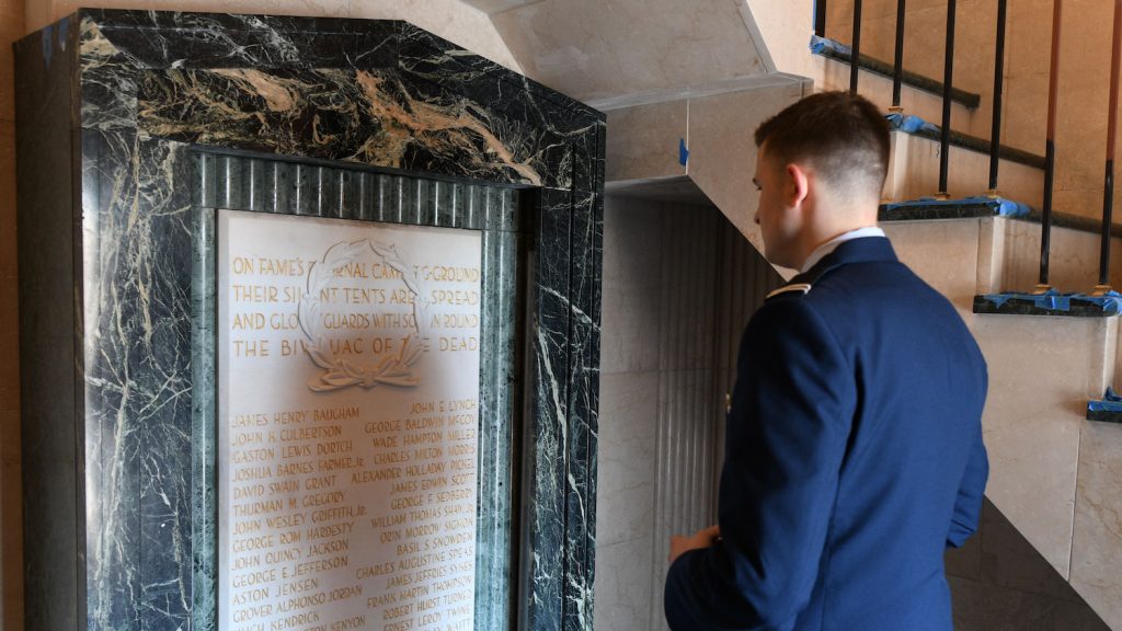 NC State Air Force Cadet Andrew Merrill takes a moment to read the names on the Shrine Room plaque and contemplate their significance.